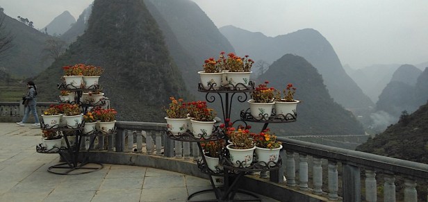 Flower pots and mountains at the "Happiness Memorial" in northern Vietnam